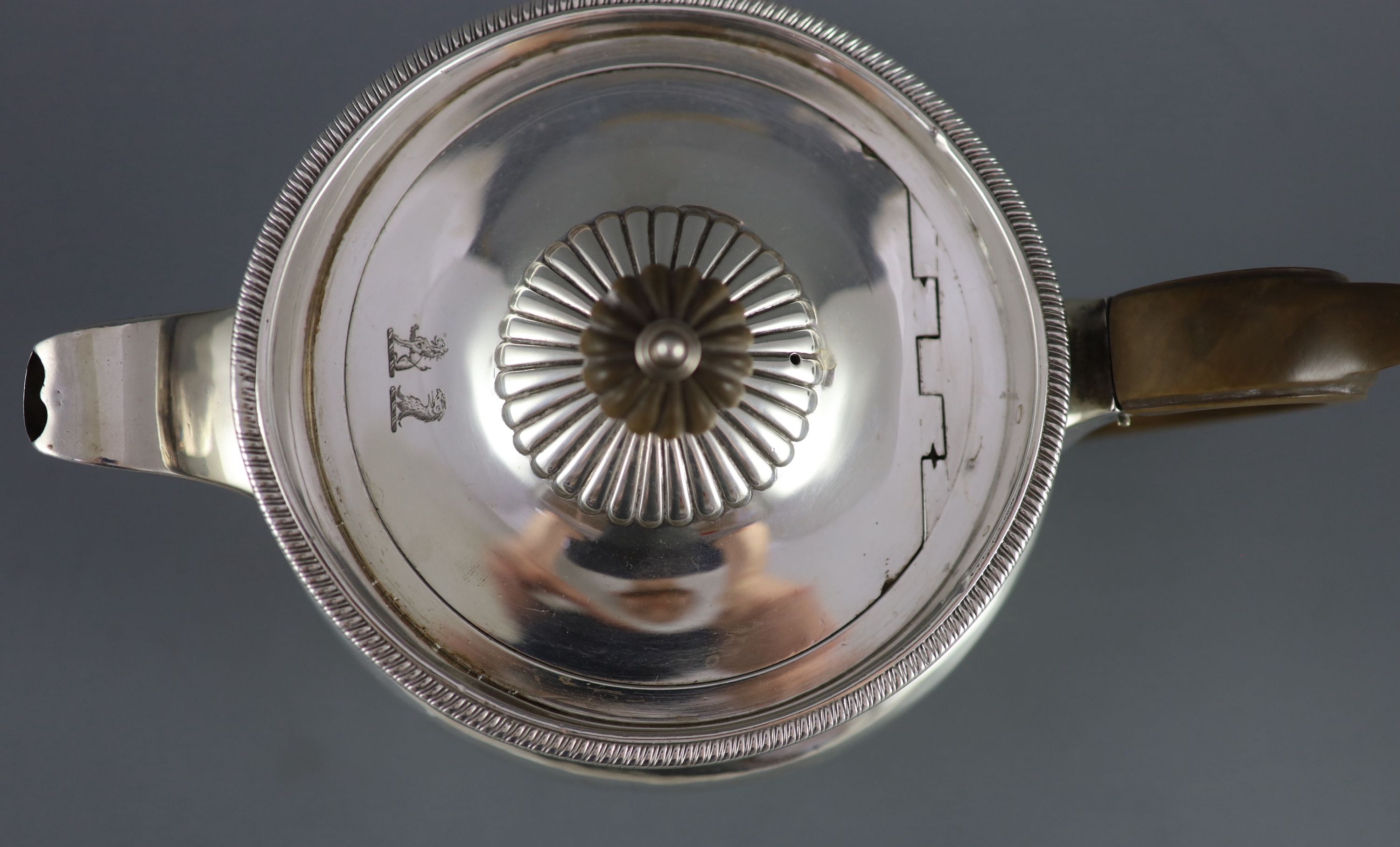 A George III demi-fluted silver squat circular teapot, by Robert & Samuel Hennell